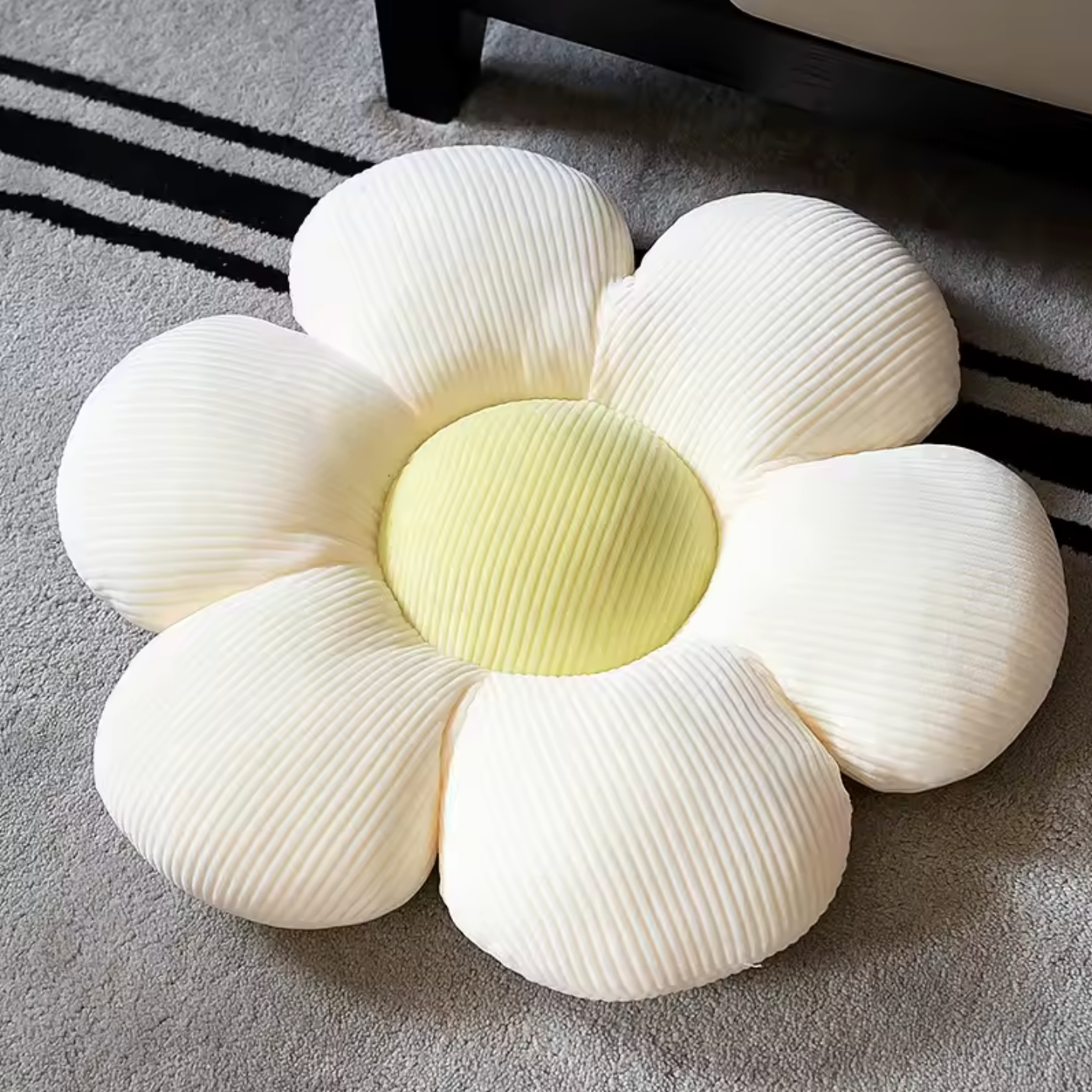 The Plantish Flower Plush Pillow in its
White/Green colour variant. The pillow is flower shaped with the petals being white and the centre green.
