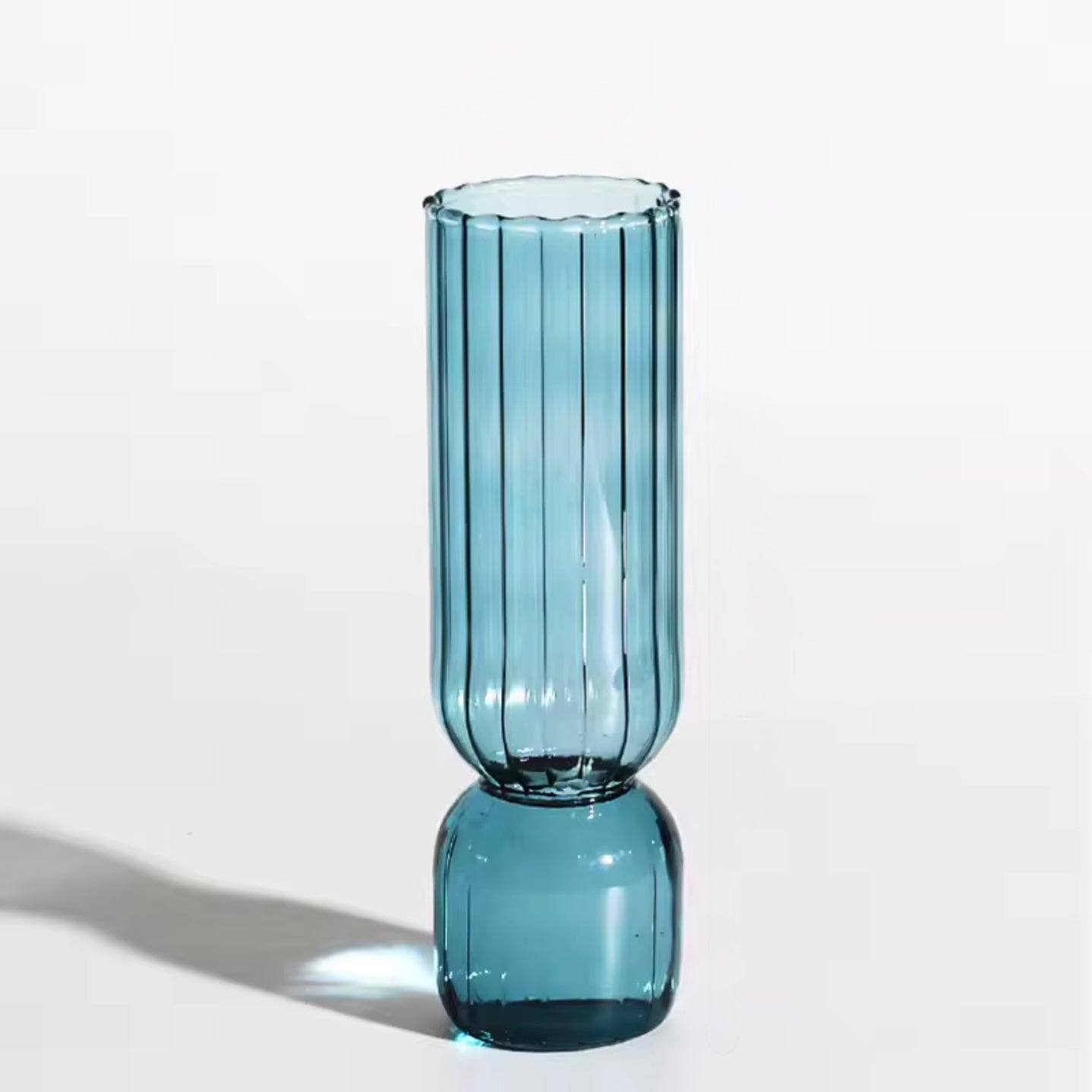 A close up of the Plantish Little Nordic Vase, light blue colour option. The vase is on a white background.