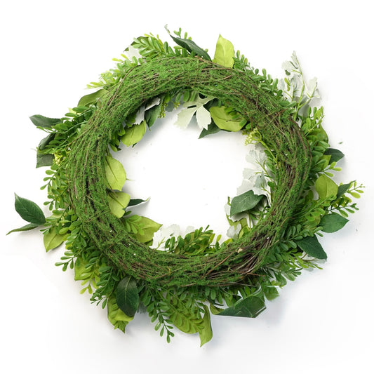 The Plantish 50cm Lush Green Foliage Wreath shown rear-on, showcasing the mixed green woodland leaves and berries, as well as the mossy natural woven ring.