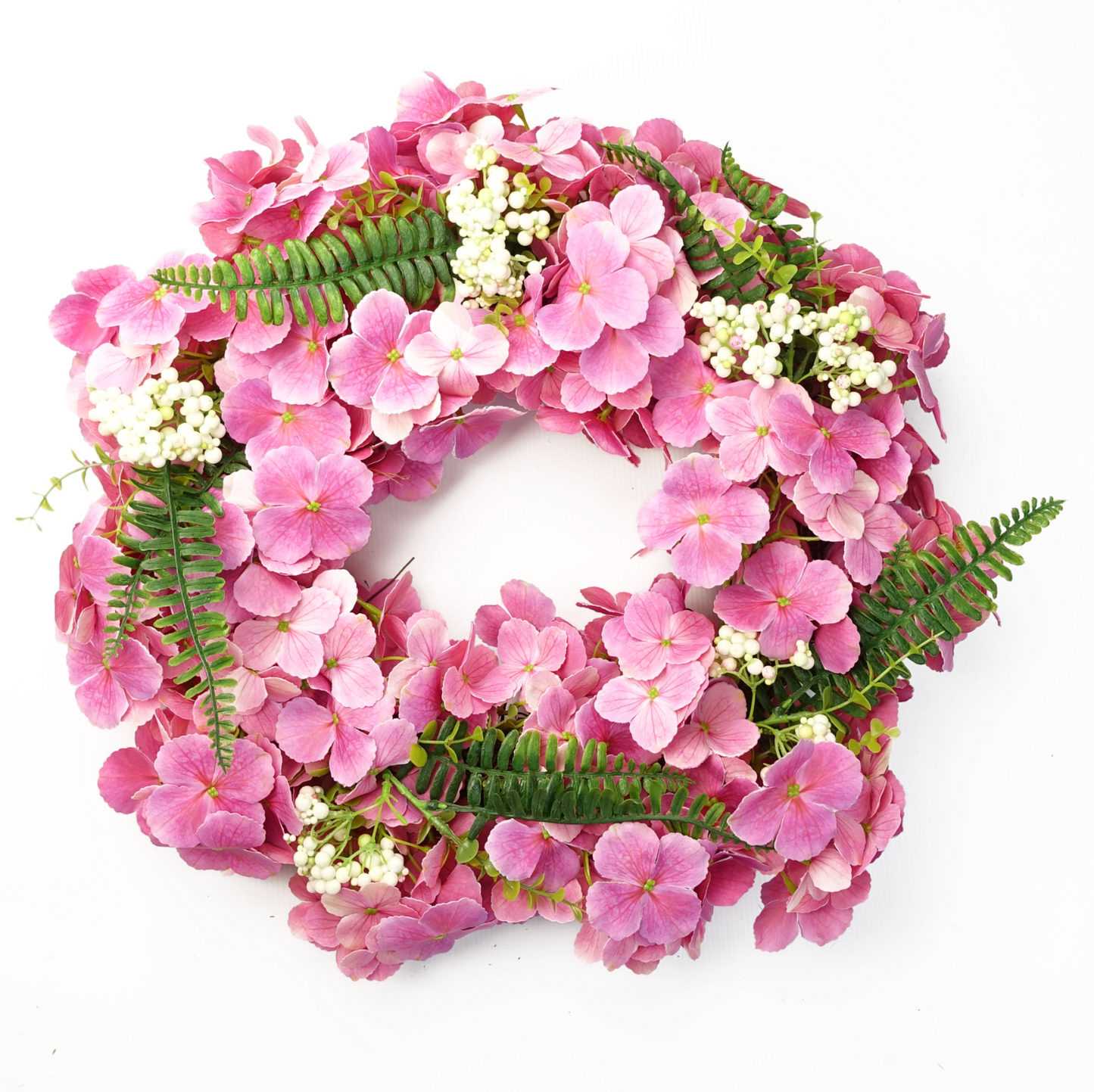 The Plantish 40cm Pink Cherry Blossom Wreath shown front-on, highlighting the vibrant pink cherry blossom flowers, green fern leaves, and white berries.