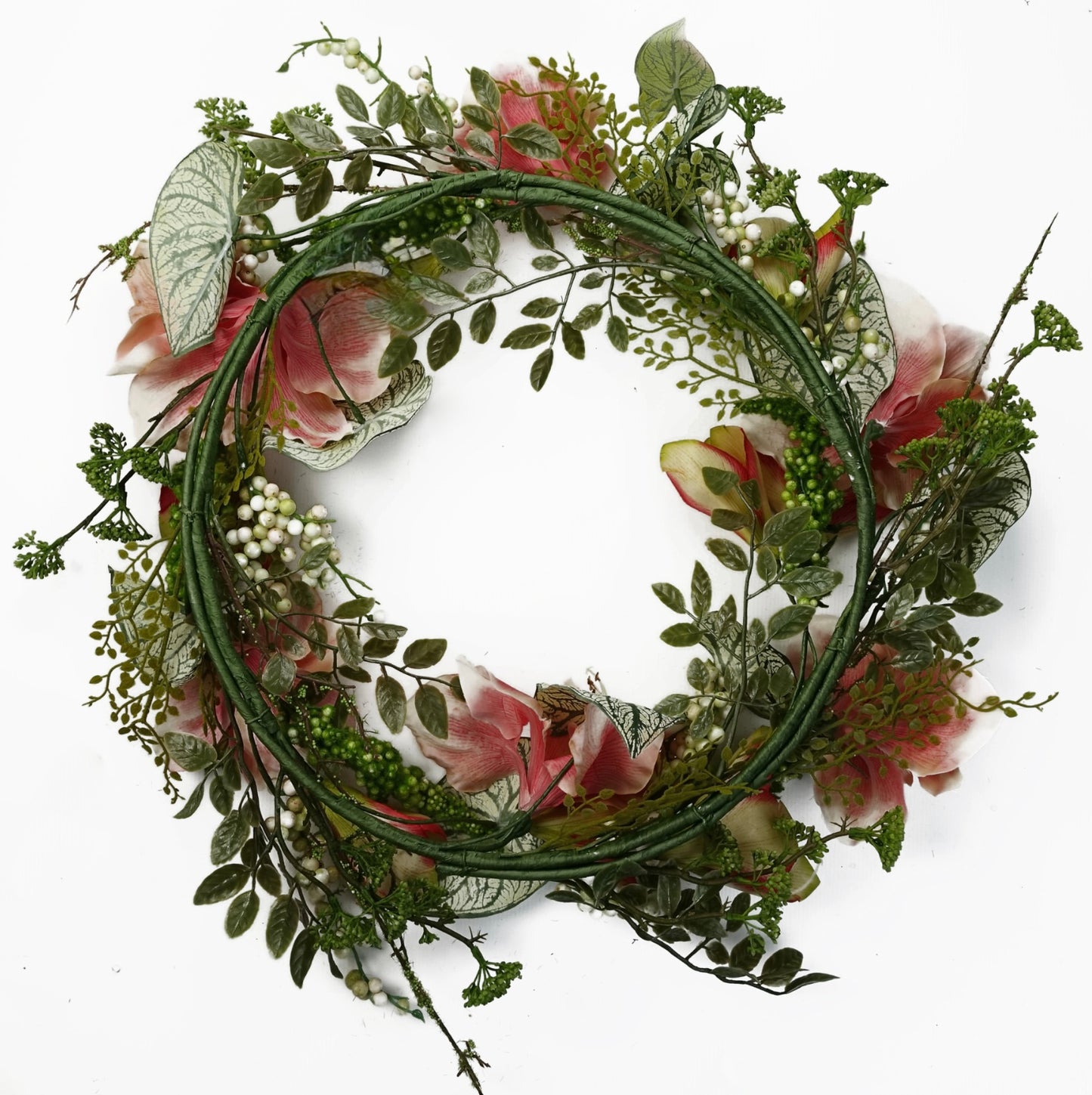 The Plantish 60cm Pink Lily Wreath shown rear-on, highlighting the green wrapped ring, pink lily flowers, variegated alocasia leaves, white berries, and small green leaves.