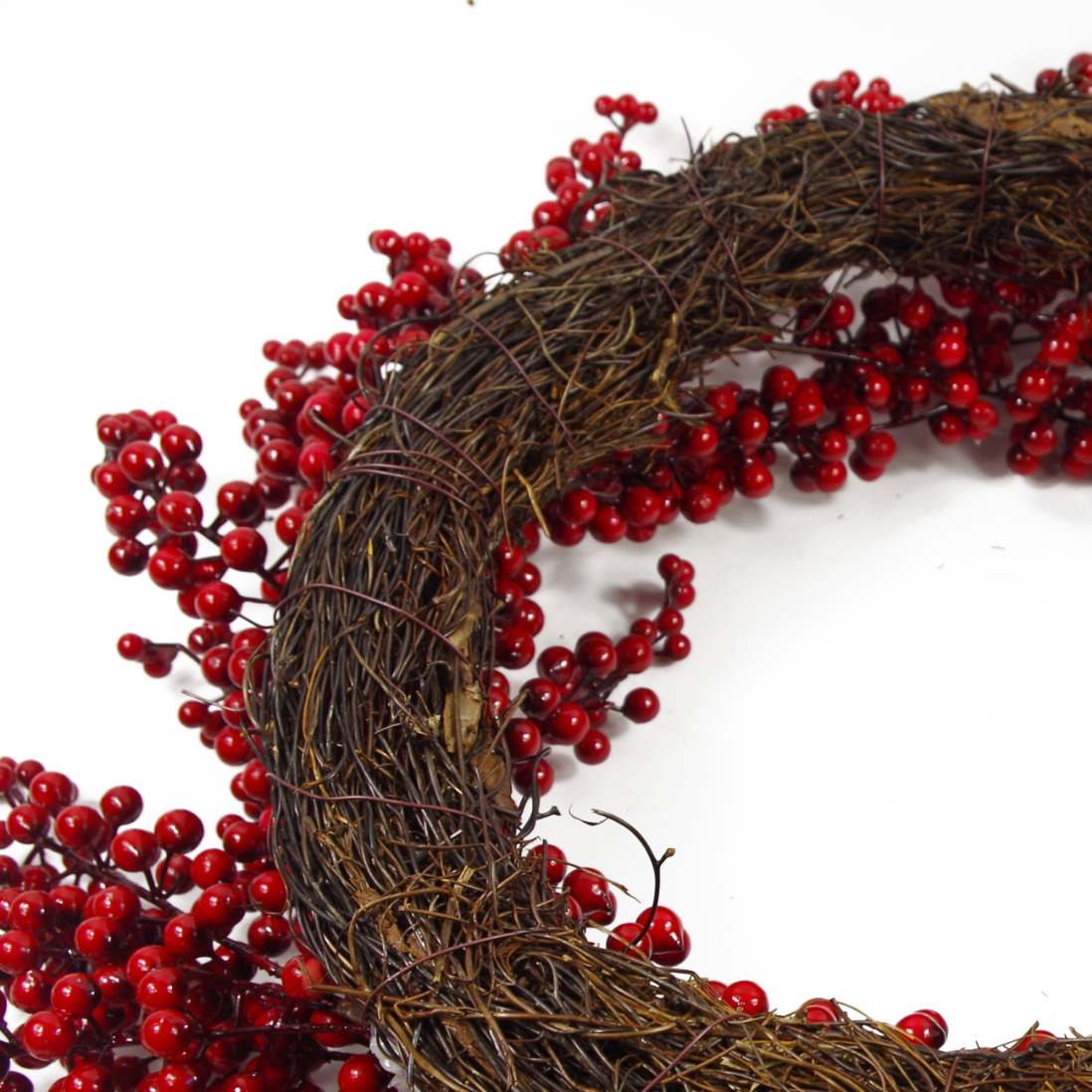 The Plantish 60cm Red Winter Berry Wreath shown from the rear, showcasing the natural woven ring in detail, as well as the red berries.