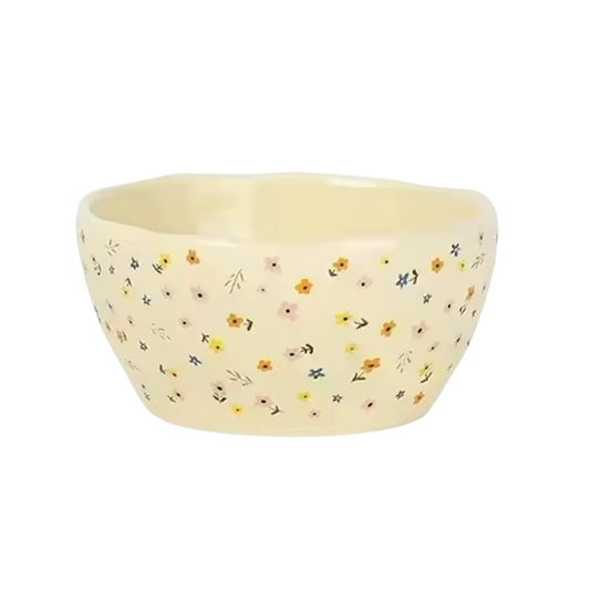 An image of the large Plantish Wildflower Bowl, highlighting the irregular shape and little multicolour flower design. The bowl is on a white background.