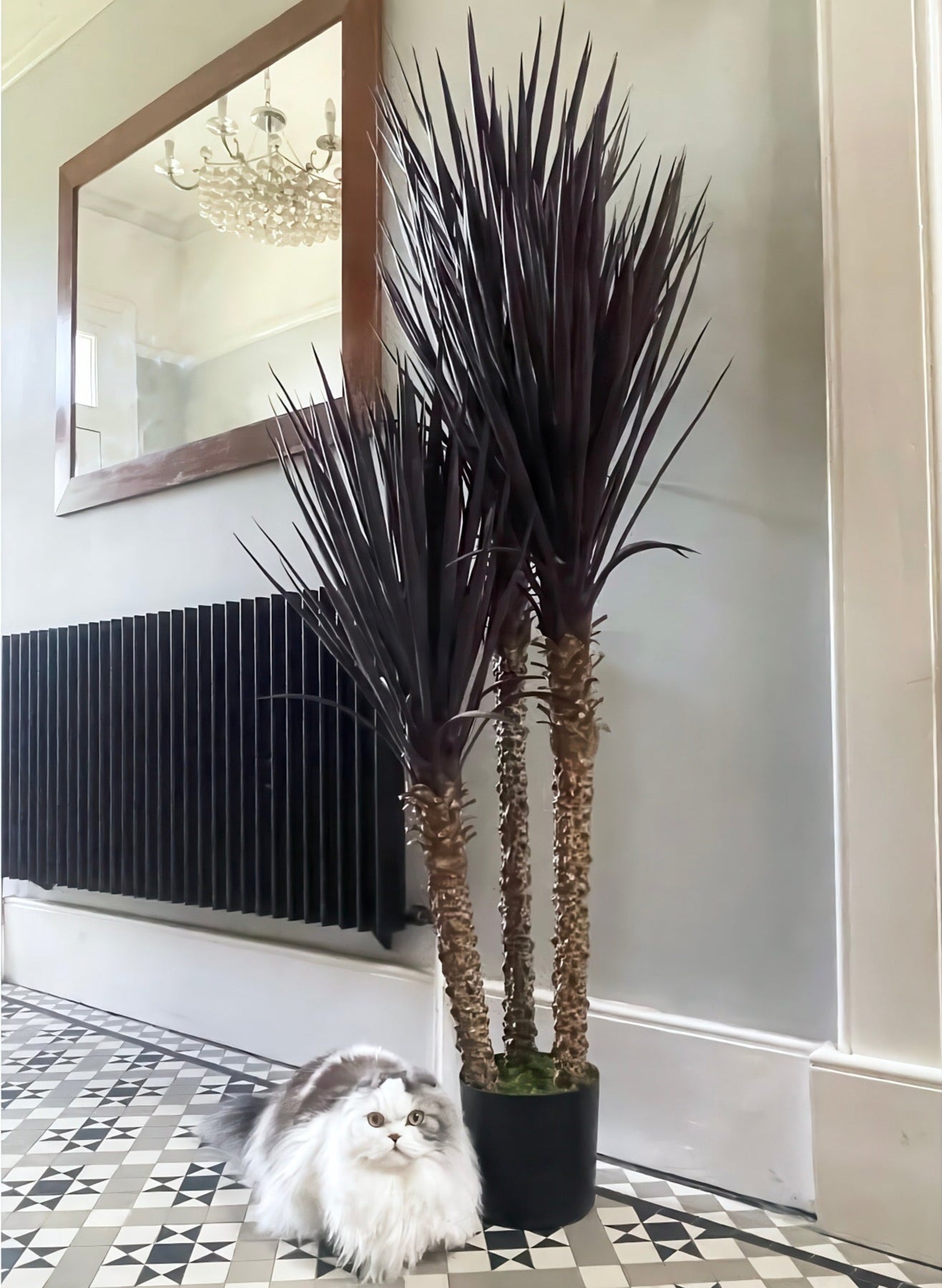 Front view of the Plantish artificial Yucca plant with three realistic trunks and dark green-brown leaves. This lifelike plant adds a bold, tropical statement to any space, offering a maintenance-free alternative to real plants with a striking, natural look.