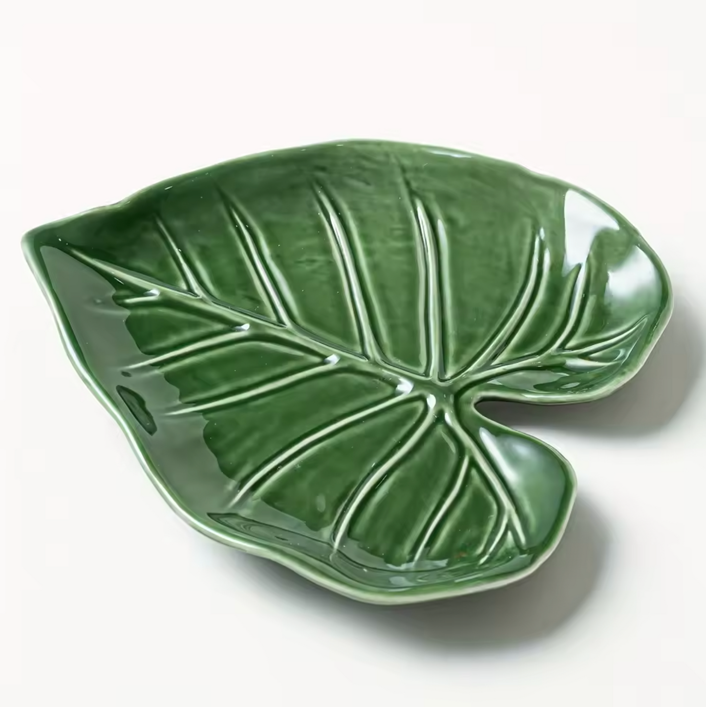 The Plantish Alocasia Leaf Ceramic Dish on a white background, highlighting the nuanced green colours and textures of the  tray. 
