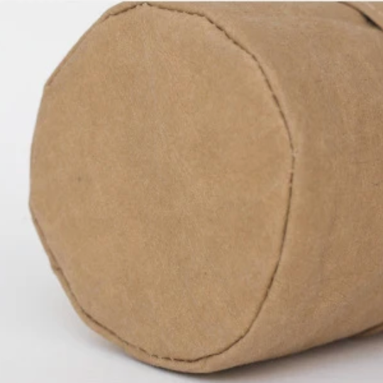 A close up view of the base of the Plantish Brown Kraft Paper Plant Pot, showing the stitched seam.