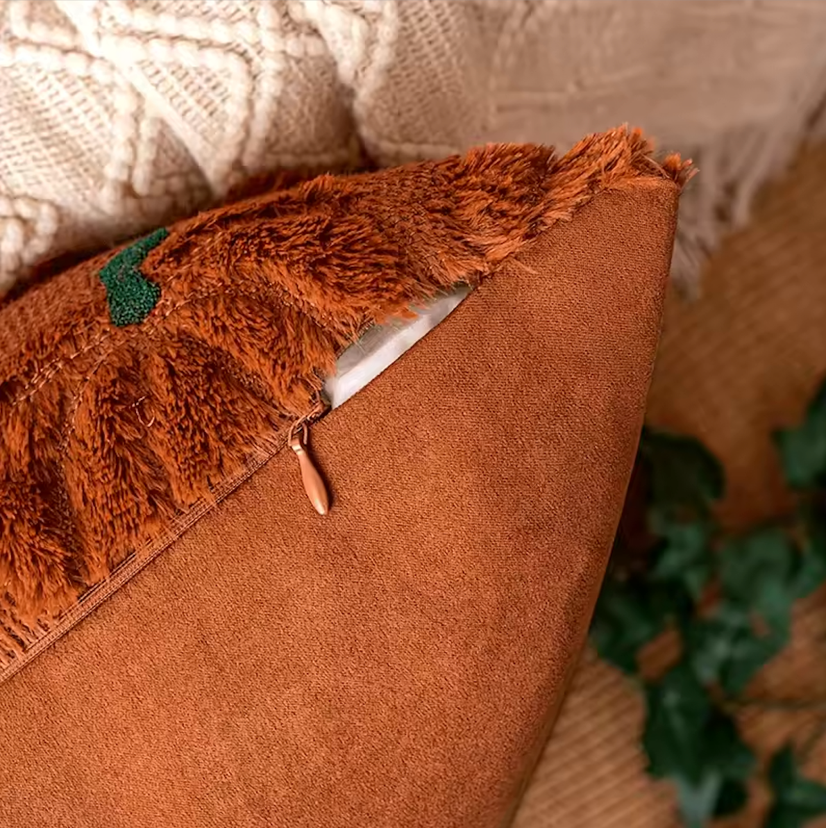 Close up zip detailing of the brown Plantish embroidered autumnal pumpkin cushion cover.
