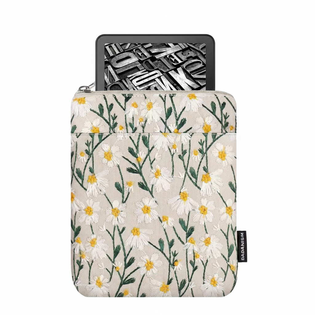 The Plantish Embroidered Little Daisy E-reader Case with a Kindle device inside on a white background