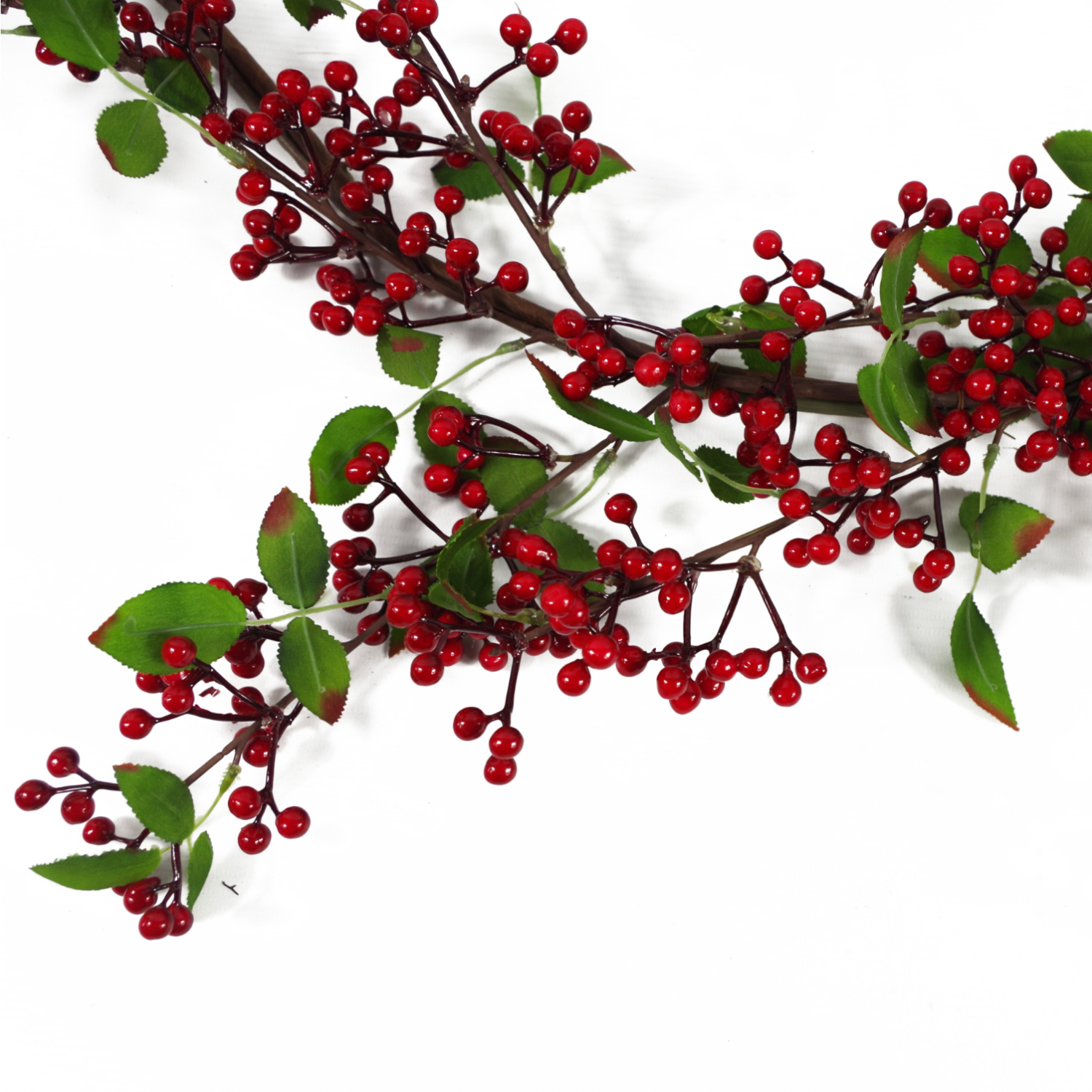 A middle distance shot of the Plantish Festive Red Berry Garland ,showing the dark red berries and green leaves, some of which have realistic brown edges.
