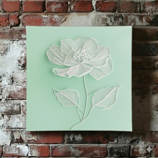 A bright Plantish canvas of a white line drawn poppy flower on a calming light green background, shown hanging on a red brick wall.