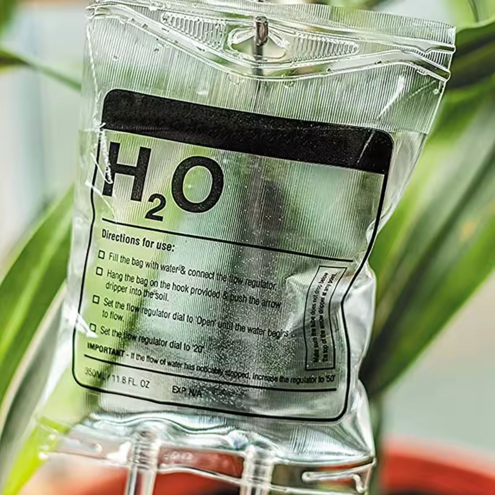 A close up of the Plantish IV Self Watering Plant Life Support Bag highlighting the details on the PVC watering bag and the hanging hook.