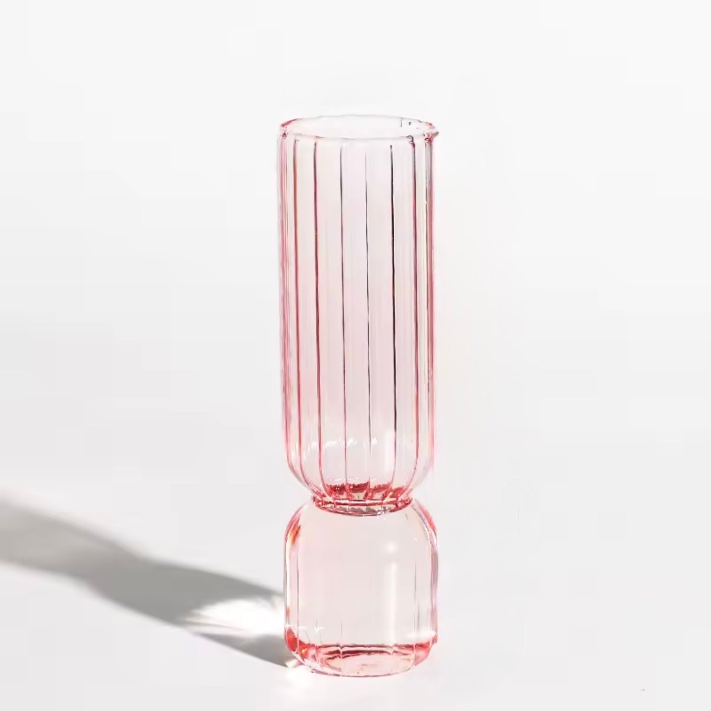 A close up of the Plantish Little Nordic Vase, pink colour option. The vase is on a white background.