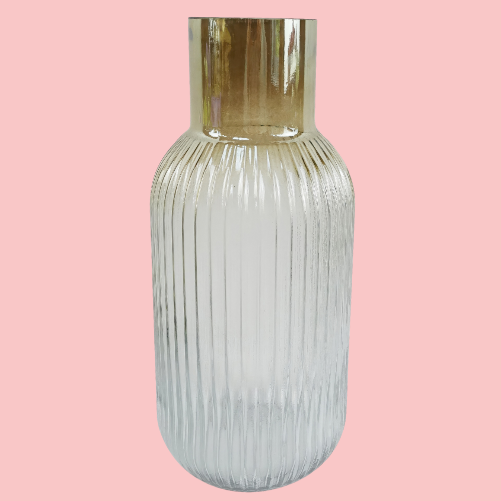 Front view of the Plantish Ombre Vase, made of clear glass, chestnut colouring around the neck and a vertical ridge design. Shown on a block pink background.