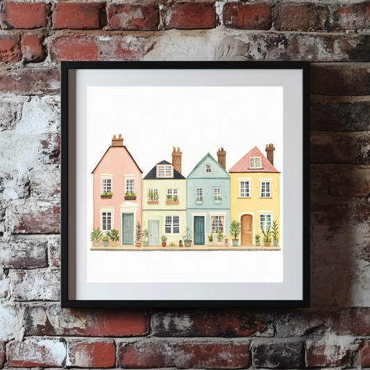 A cute and vibrant sketch print of a row of pastel coloured houses on a street full of plants, framed and mounted on an exposed brick wall. 