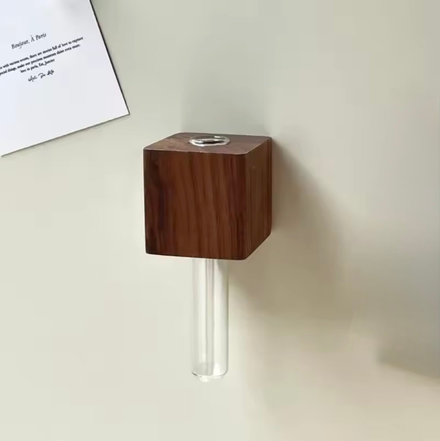  The Plantish Propagation Fridge Magnet in the Dark Wood variant, shown empty and attached to a fridge. The glass vial is shown up close.