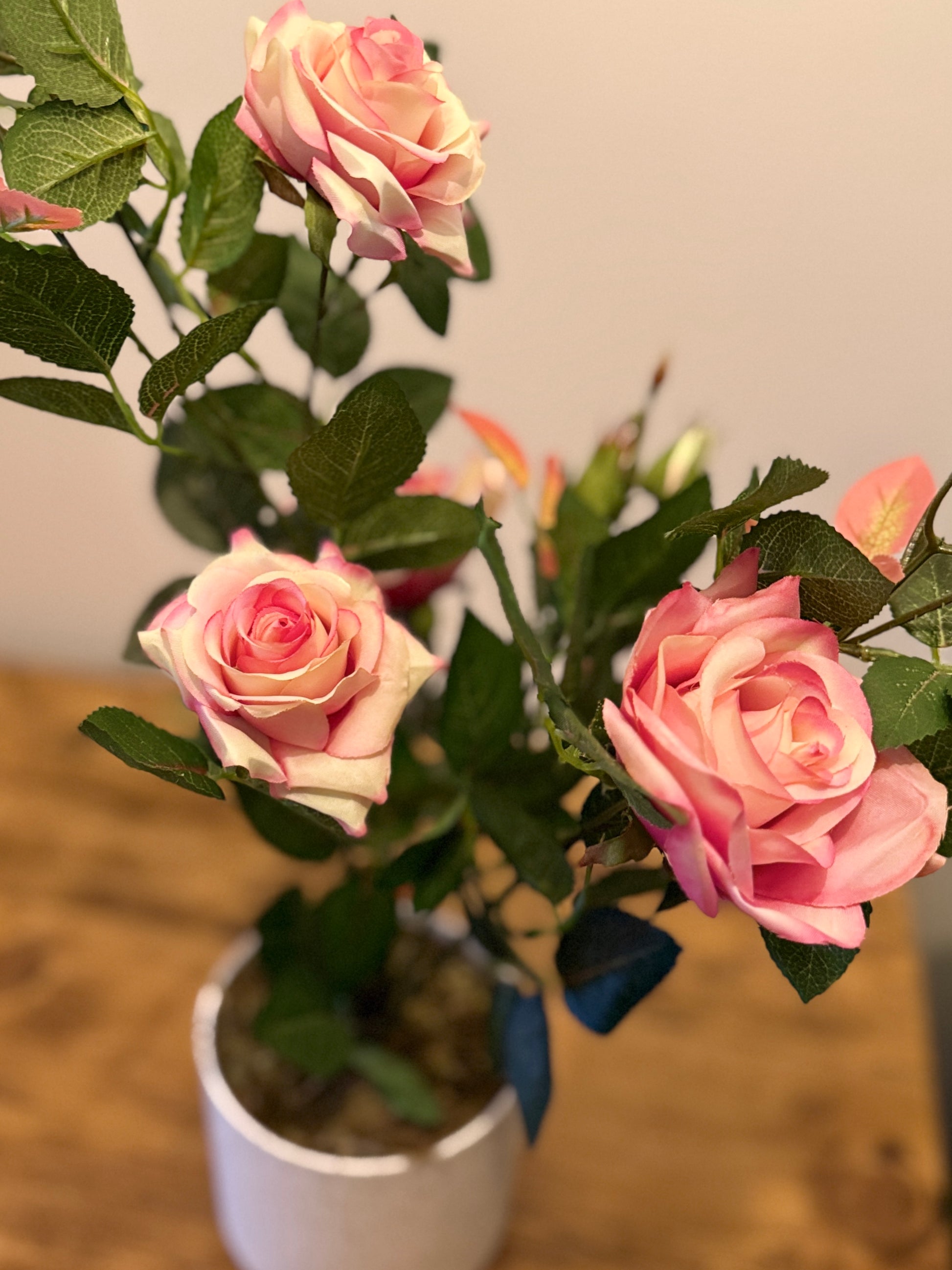 Close up of the Plantish artificial pink rose, highlighting the soft, layered petals and intricate detailing for a lifelike, natural look.