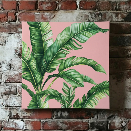 A Plantish canvas of stylised green palm leaves against a pastel pink background, shown hanging on a red brick wall.