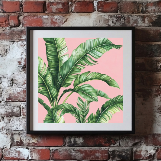 A Plantish print of stylised green palm leaves against a pastel pink background, shown hanging on a red brick wall.