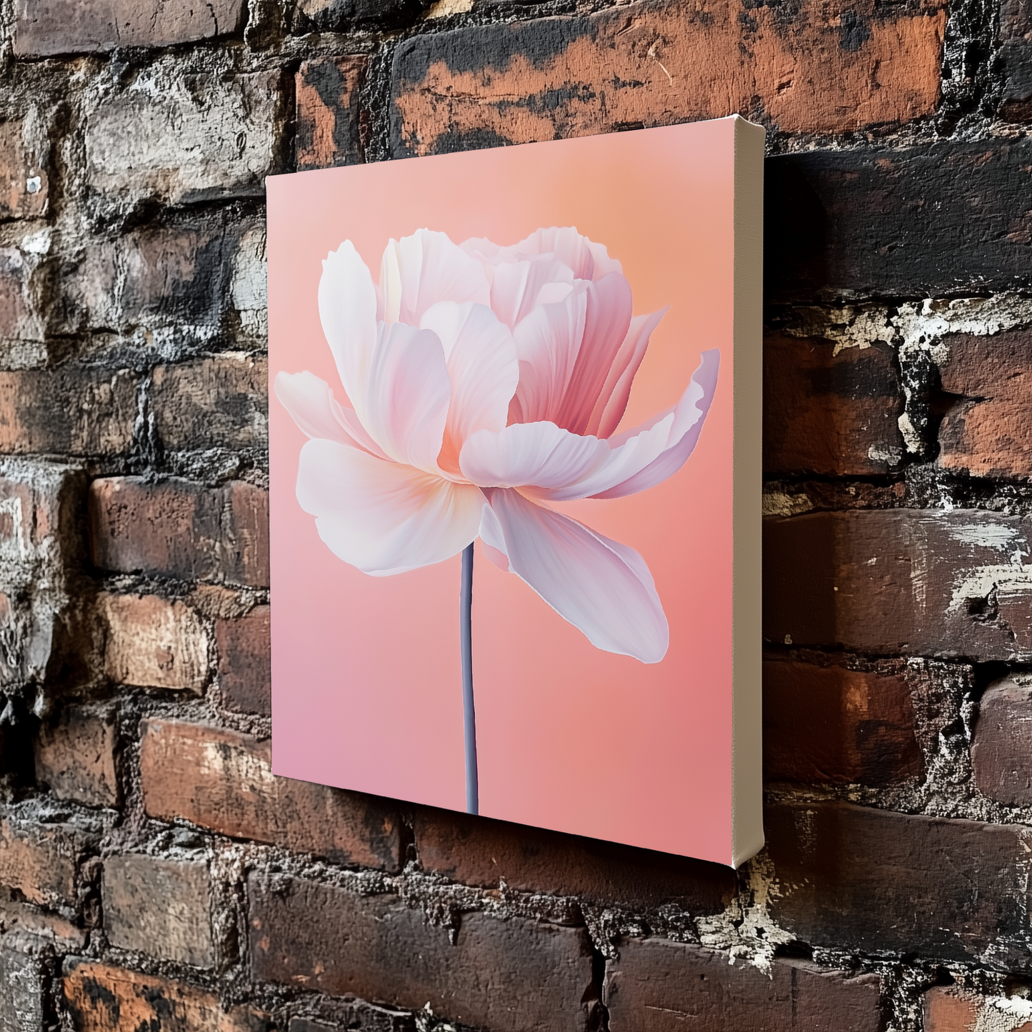 An abstract brightly coloured canvas of a single poppy viewed from the side in beautiful hues of pink, white, and orange, mounted on an exposed brick wall. 