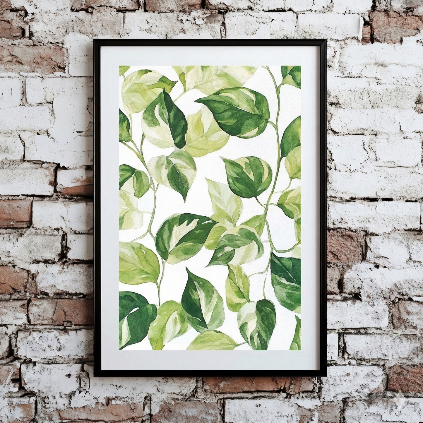 A neutral Plantish print of devils ivy leaves in a watercolour green against a white background, shown hanging on a distressed brick wall.