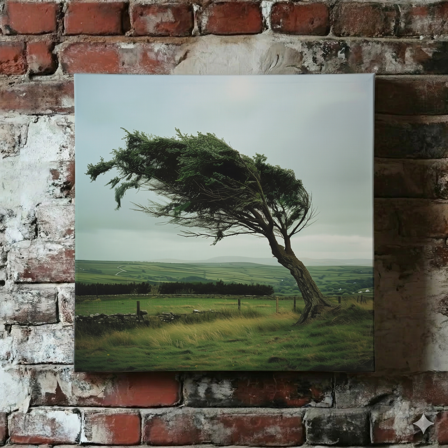 A Plantish canvas of a surreal but photorealistic tree being hit by strong winds standing in rolling green countryside, shown hanging on a red brick wall.